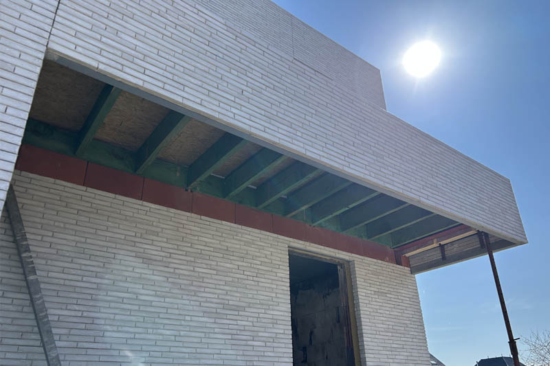 Luifel met houten roostering in Appelterre